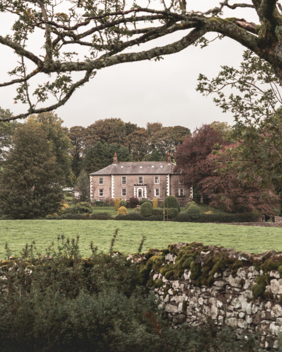 Exterior of Brownber Hall, Cumbria from across a field
