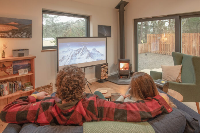 Watching a film at Cairngorms Cabin