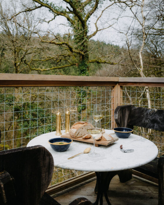 Table and chairs on the outdoor terrace of Chatan, Devon