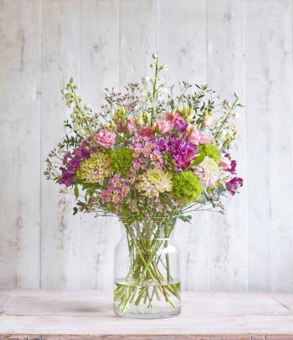 A bunch of Freddie's Flowers in clear vase