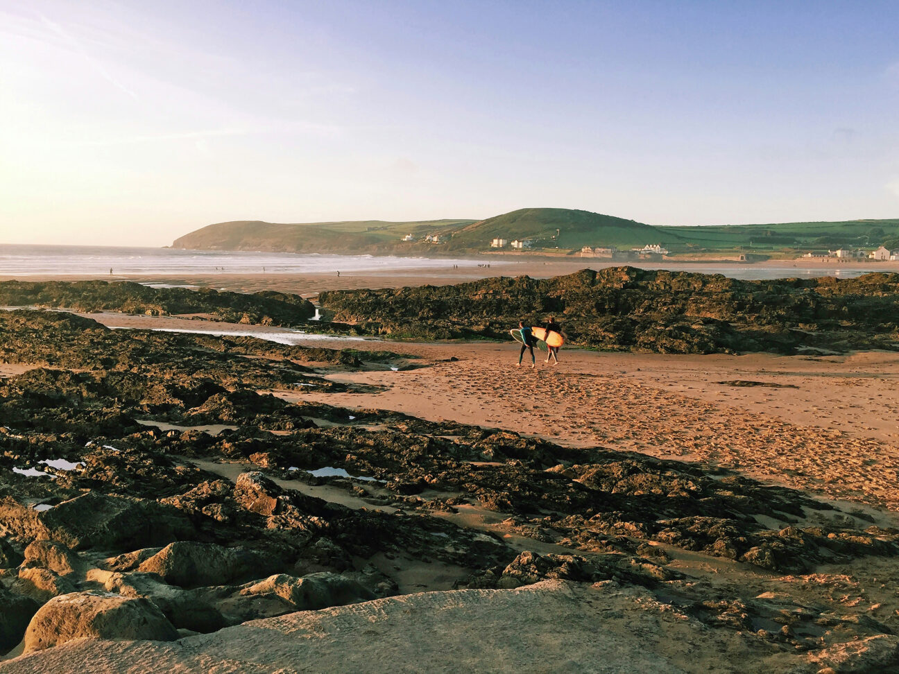 Surfing on Croyde Beach by Max Randall via Unsplash